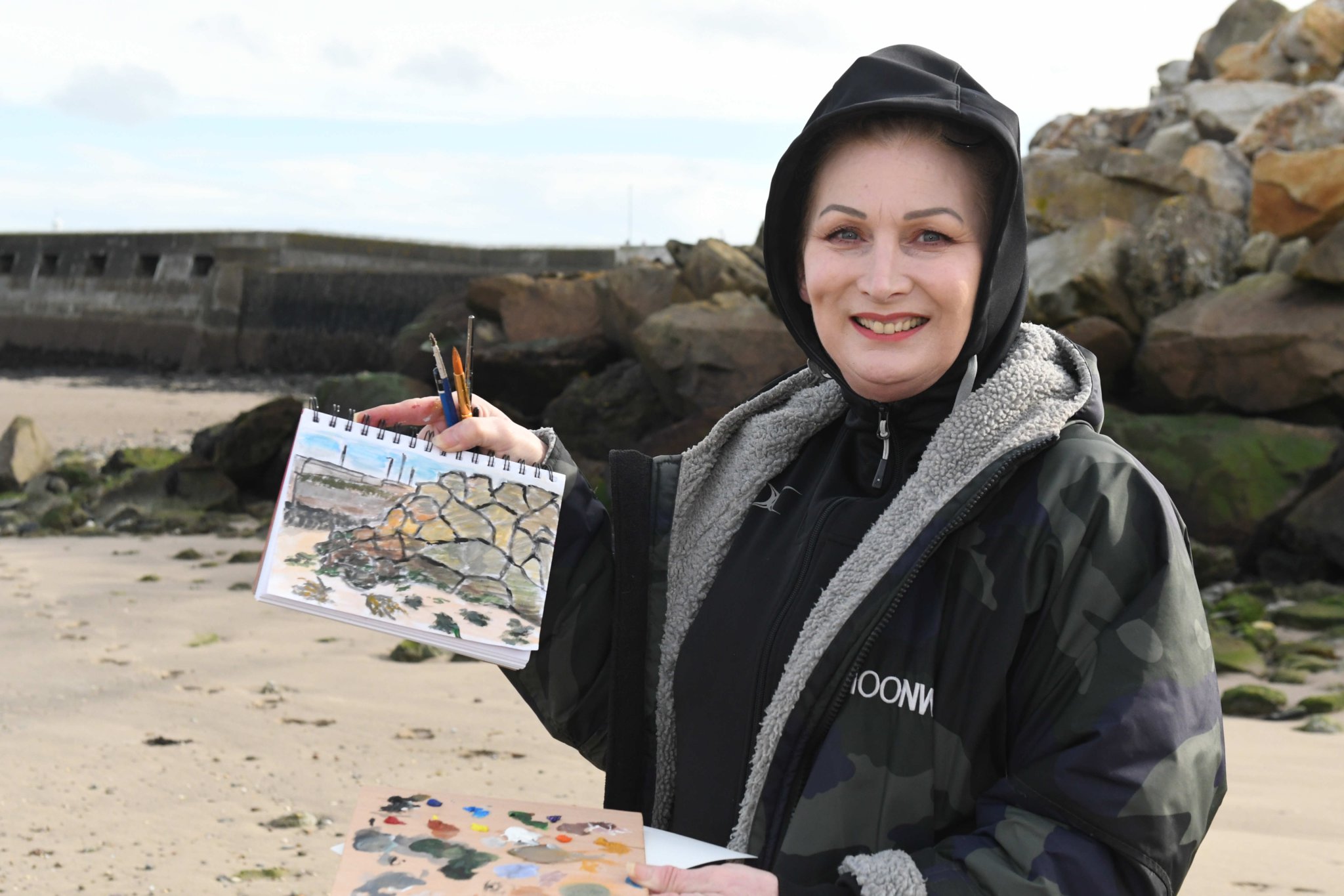 Painting on Ramsey beach with Manx Wildlife Trust artist in residence Clare Payne, as part of Love Your Beach Week - pictured is Debbie Perry