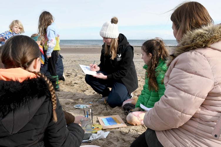 Painting on Ramsey beach with Manx Wildlife Trust artist in residence Clare Payne, as part of Love Your Beach Week - pictured is Clare Payne