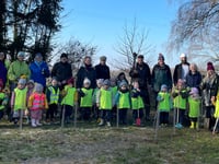Young and old plant trees in Shalden to remember the Queen