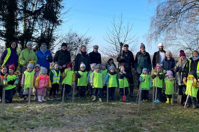 The Queen's Green Canopy project tree planters, Shalden Recreation Ground, February 2023.