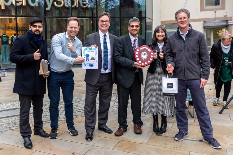 The winning team from Kent, the energy services company based in Chertsey Road, pictured with MP Jonathan Lord and Woking Mayor Cllr Saj Hussain.