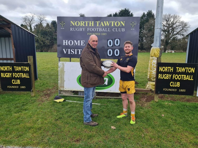 Andy Pyle, game sponsor, left, with Jack Phare, captain.