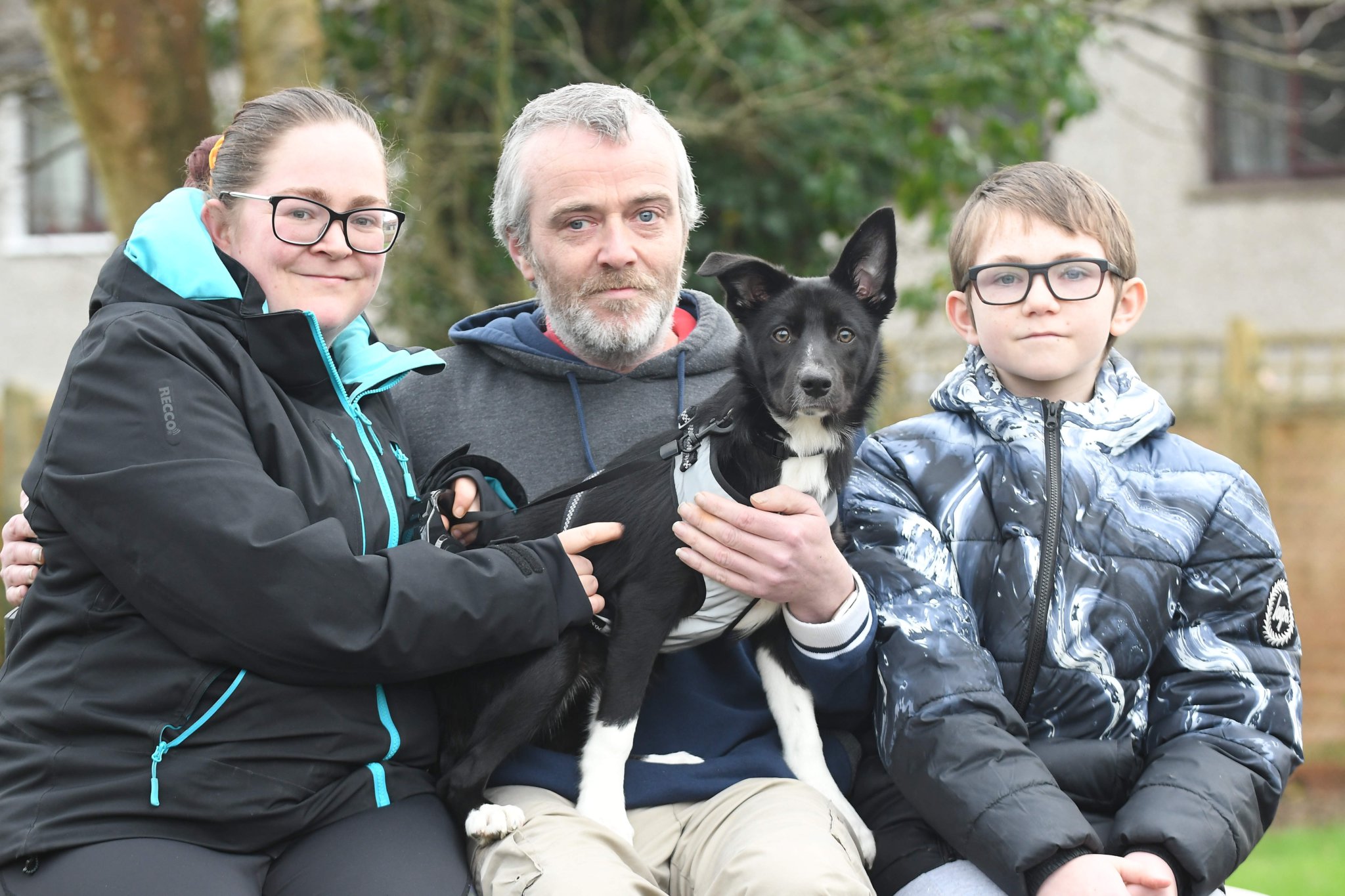 Lucy the 5-month-old border collie puppy, who disappeared in Conrhenny Plantation and was found after four days of searching - pictured with owners Jemma Ryan, Pip Quayle and Jamie Quayle (12)