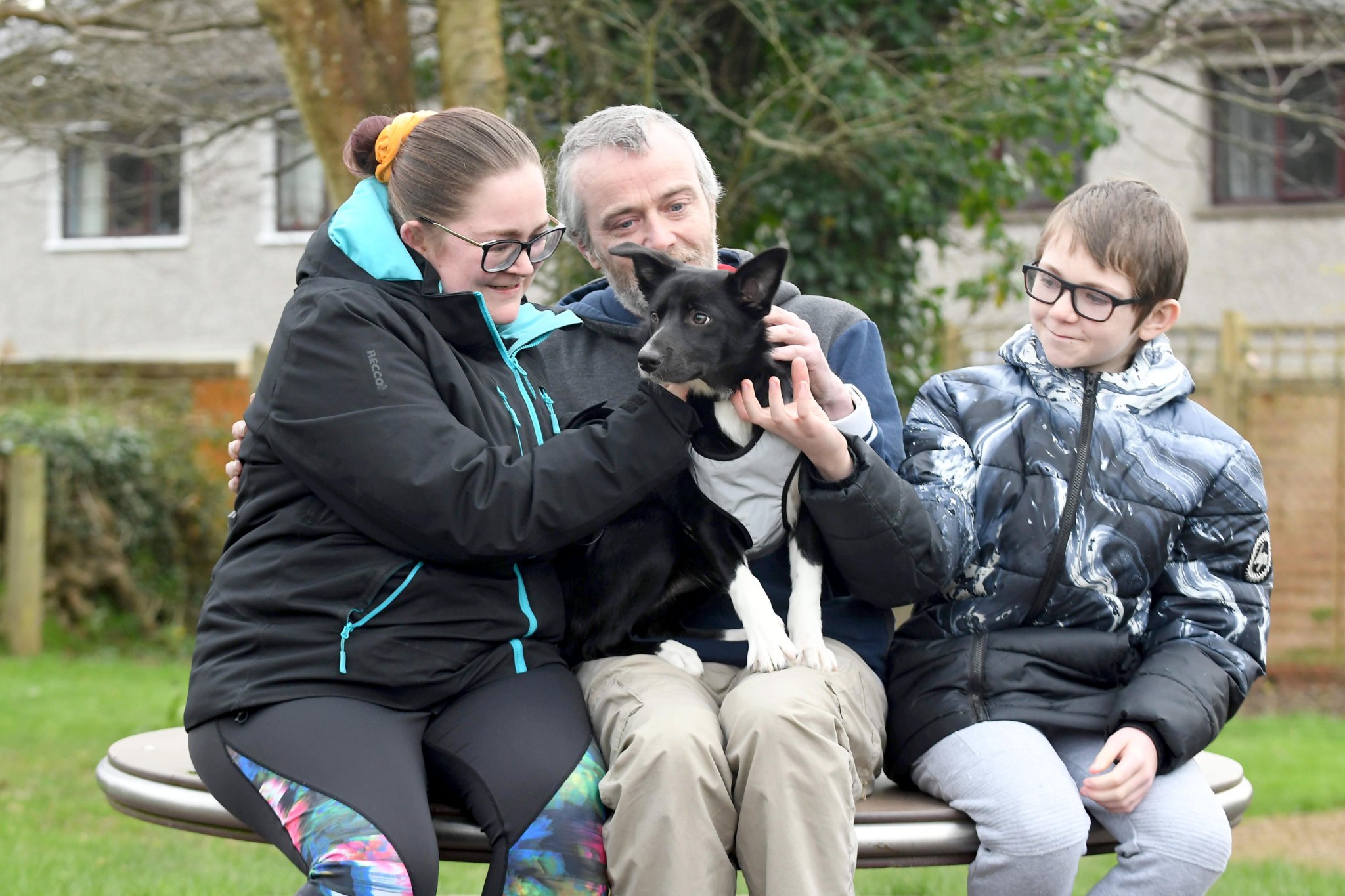 Lucy the 5-month-old border collie puppy, who disappeared in Conrhenny Plantation and was found after four days of searching - pictured with owners Jemma Ryan, Pip Quayle and Jamie Quayle (12)