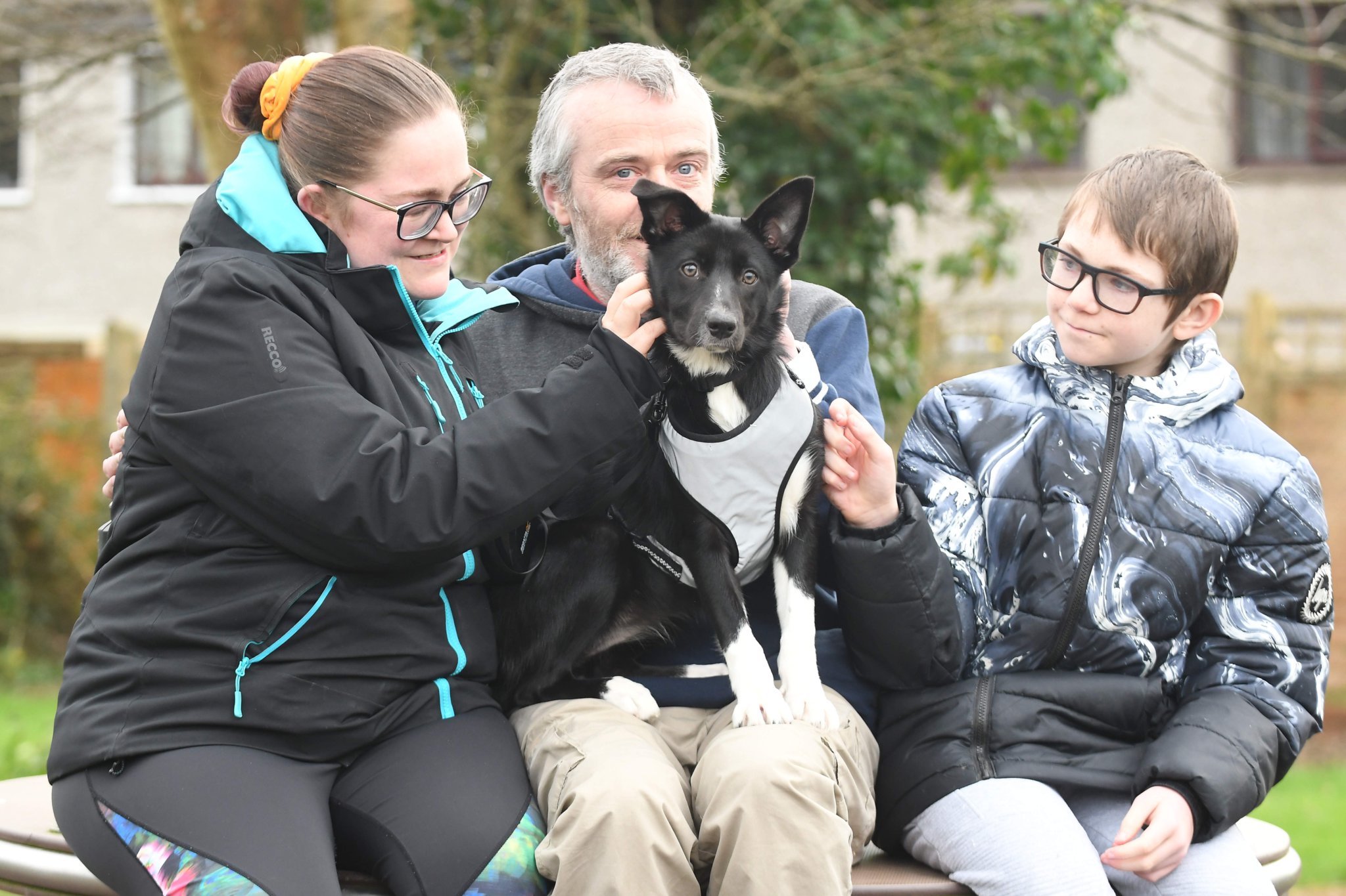 Lucy the 5-month-old border collie puppy, who disappeared in Conrhenny Plantation and was found after four days of searching - pictured with owners Jemma Ryan, Pip Quayle and Jamie Quayle (12)