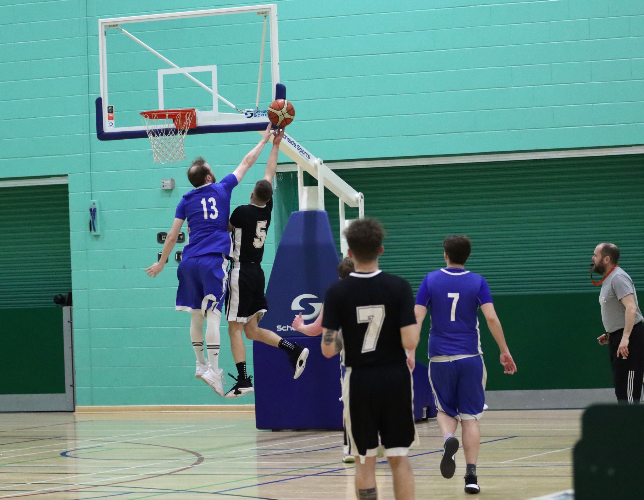 Wolves captain Ross Wilson leaps in to block Jets’ Jakob Glover’s drive to the basket during the two sides’ Senior League clash at the NSC on Thursday. Wolves ran out 79-55 winners (Photo: Kyle Furlong)