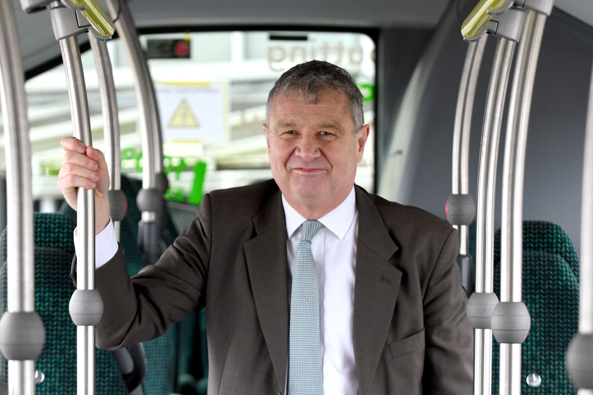 A zero emission Mercedes ‘eCitaro’ electric bus being tested on the island’s roads - pictured is Infrastructure Minister Chris Thomas