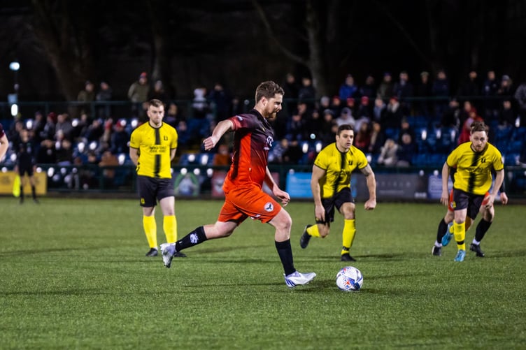 Jack McVey slots home the winning goal from the penalty spot after team-mate Eoghain Sherrard had been fouled inside the Winsford area (Photo: Gary Weightman)