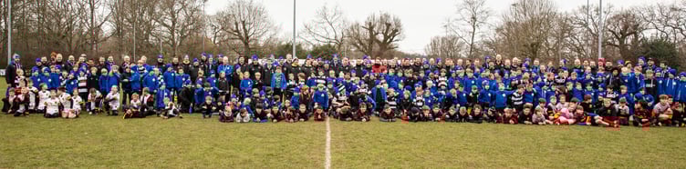 The 2023 Farnham Rugby Club Mini Tour players and coaches line up with some of the opposition from Chard