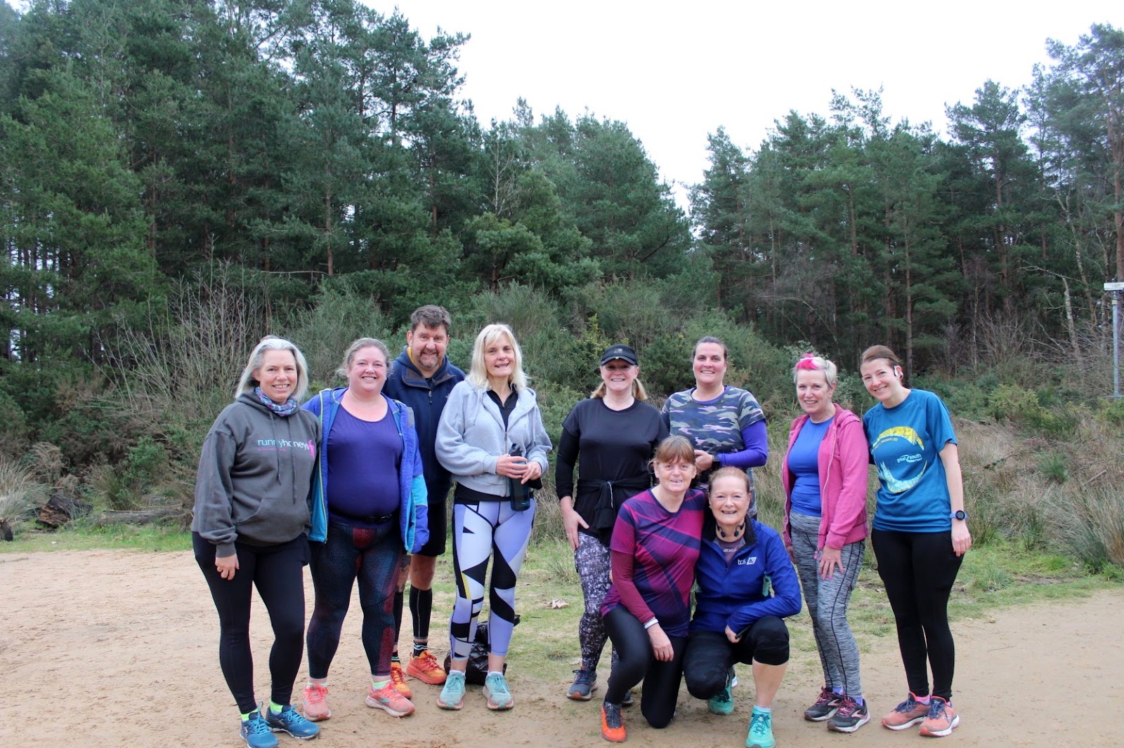 Members of Haslemere Borders celebrate with Janet Govan on reaching her 50th volunteer and parkrun milestone