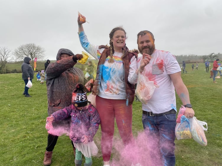 Pink powder fills the air at the festival of Holi event at the Manx Fun Farm, in Onchan