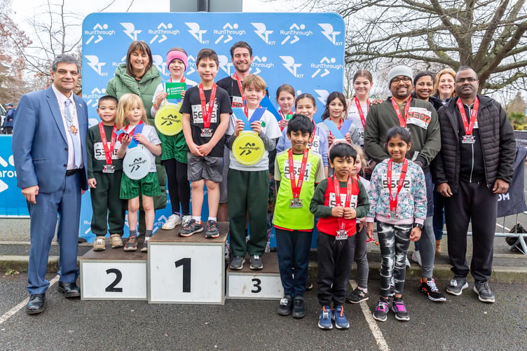 Some of the Knaphill Federation of Schools' runners, with Woking Mayor Cllr Saj Hussain.