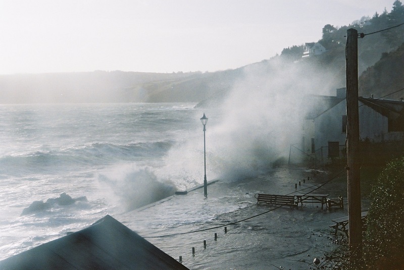 Patricia Newton's photograph of the old End Cafe being hit at high tide