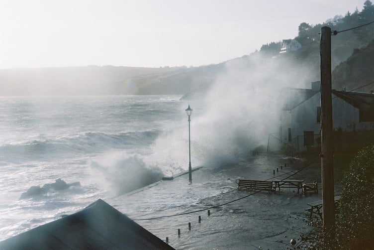 Patricia Newton's photograph of the old End Cafe being hit at high tide