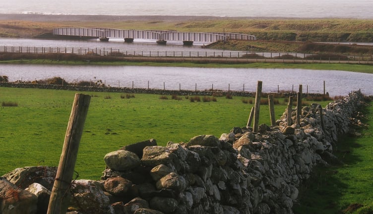 Stone wall and railbridge at Tonfanau