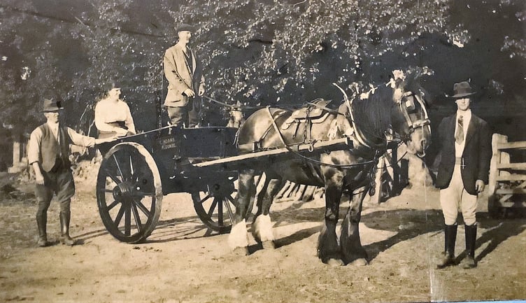 Fred Adams, standing left, and Ellen Adams, 1920