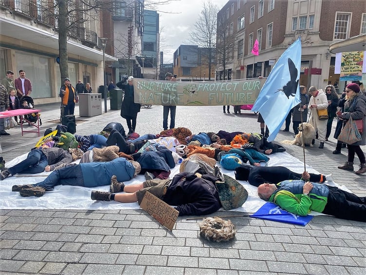 Extinction Rebellion members from Teignbridge took part in a 'die in' during their march from Southenhay, Exeter, to Bedford Square.Pictures: Annie Mitchell (April 2023)