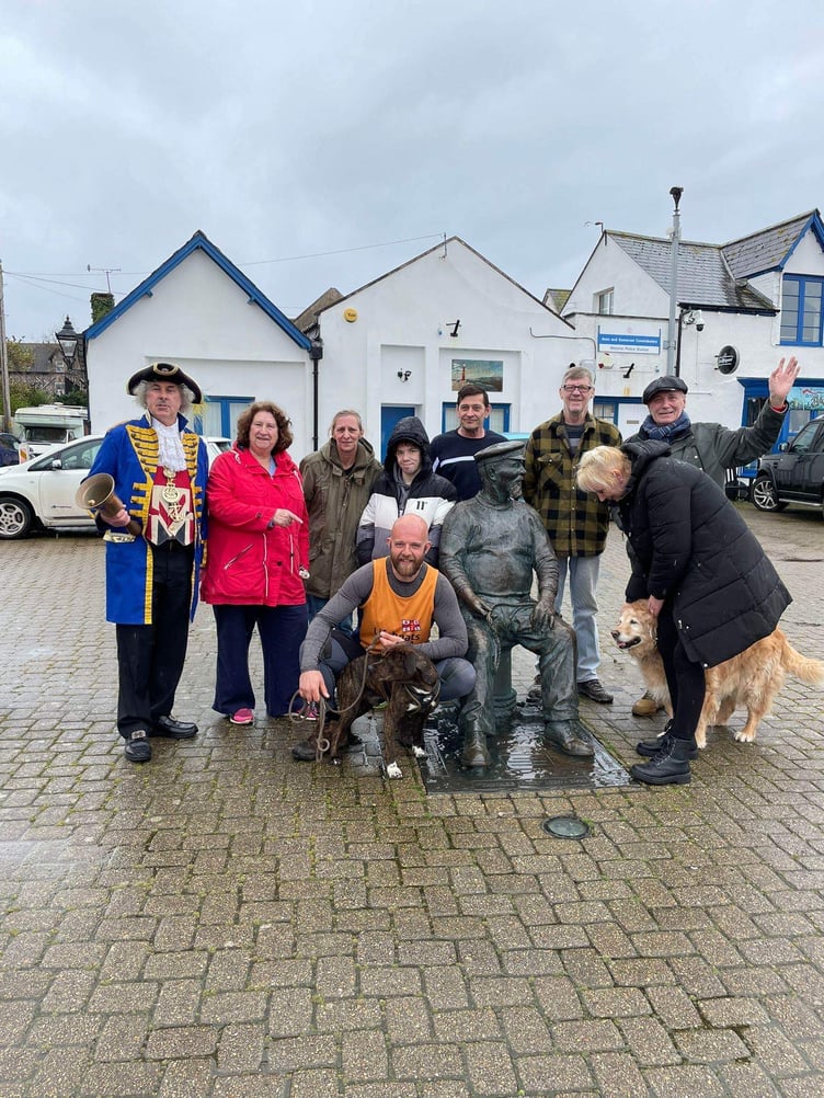 Watchet residents greet Tim Jones and Monty on The Esplanade.