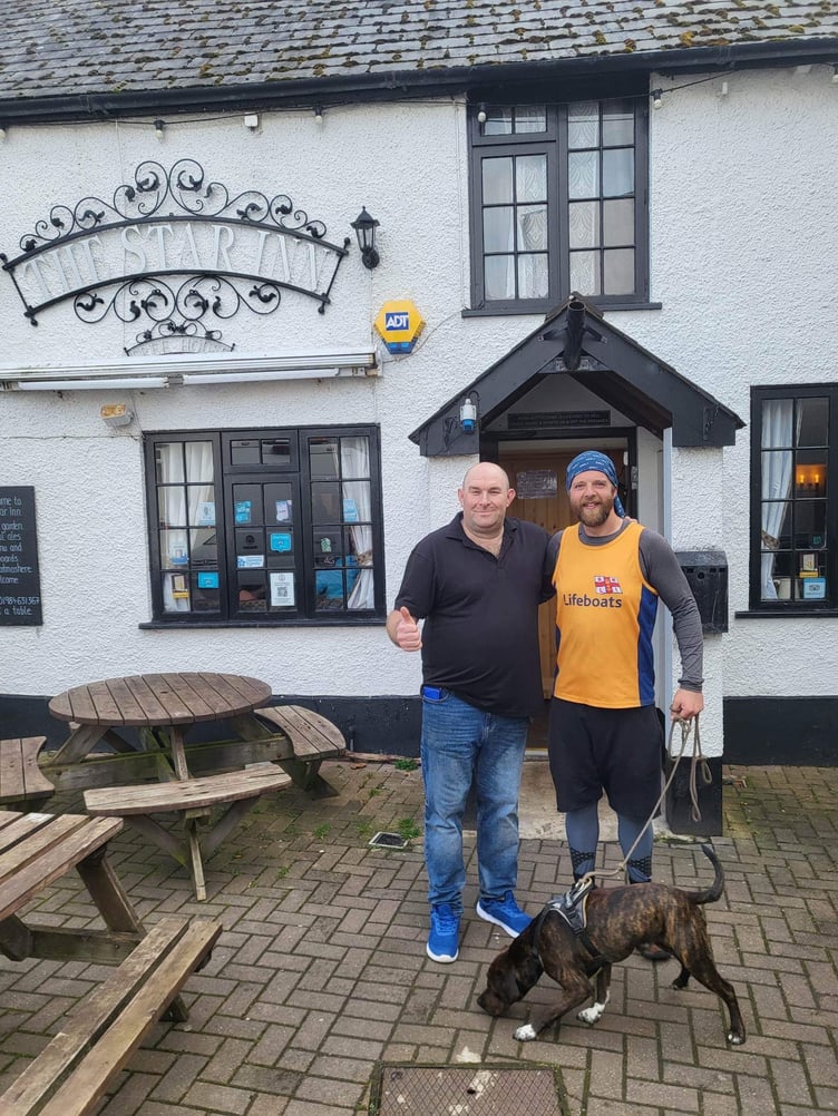 Tim Jones and Monty with barman Jason Sinclair at The Star Inn, Watchet.