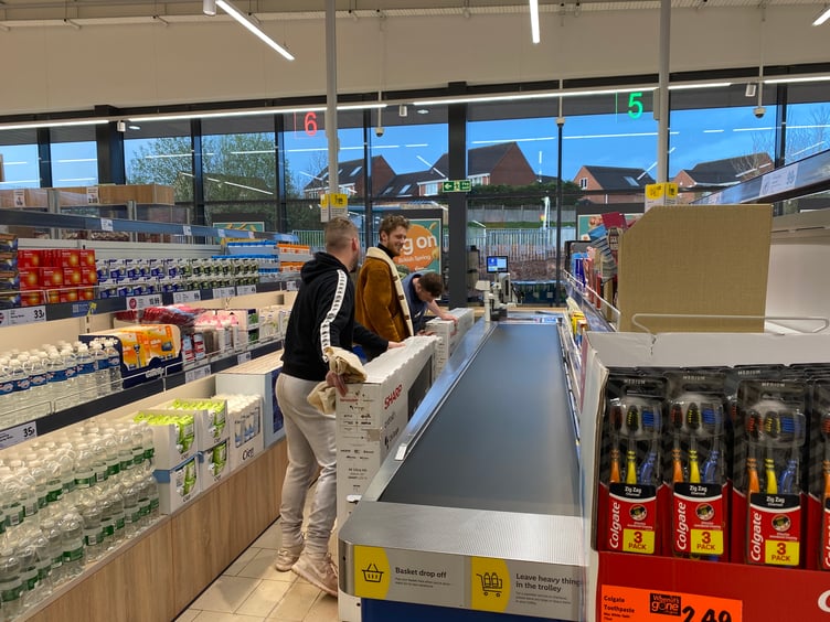 Excited shoppers haul cut-price TVs to the checkouts
