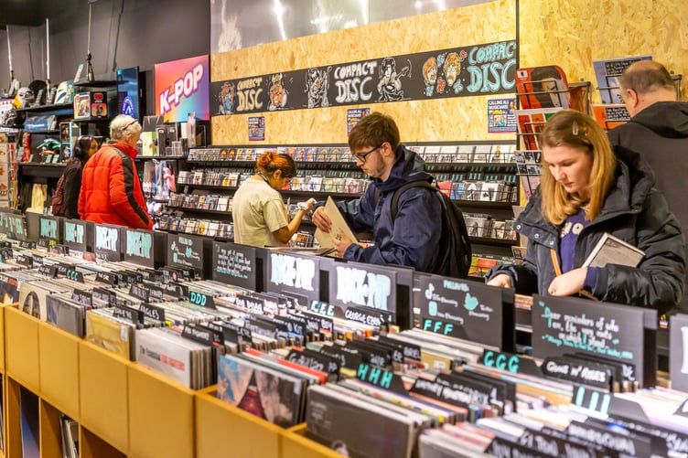 HERITAGE – The store includes nods to Woking-based music and film connections, such as The Jam and War of the Worlds artwork.
