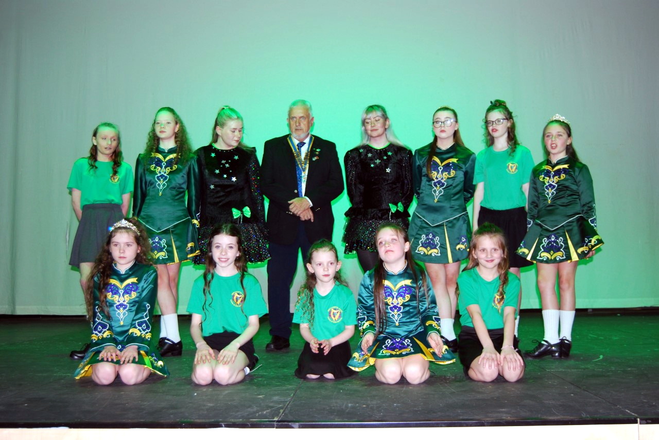 Dancers of the Bernadette School of Irish Dancing with Pembroke Rotary president Gavin Lloyd.