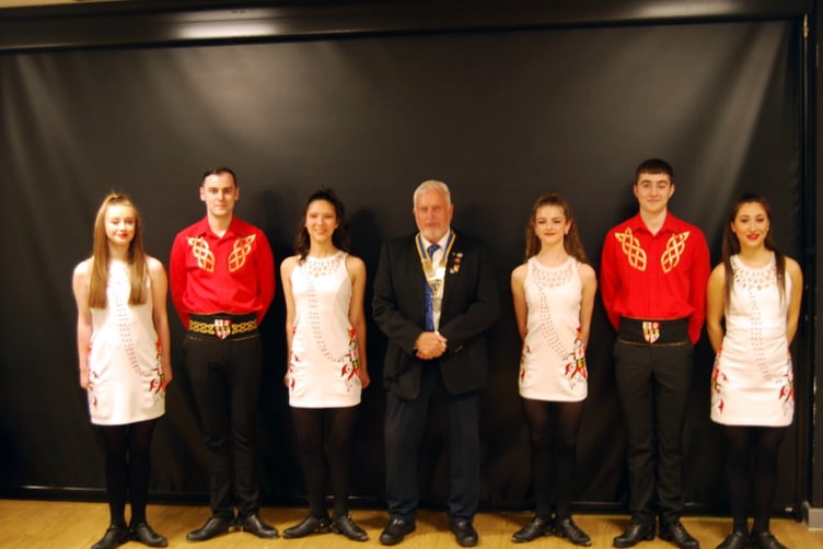 Dancers of the Bernadette School of Irish Dancing with Pembroke Rotary president Gavin Lloyd.