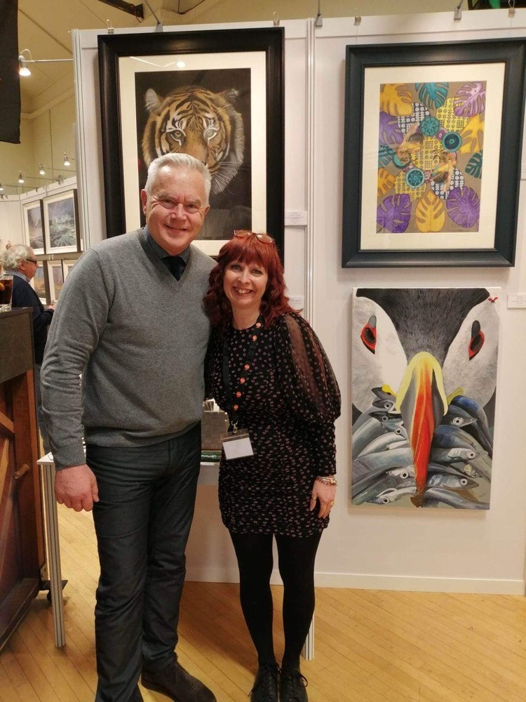Jane Lloyd with newsreader Huw Edwards at the exhibition in London