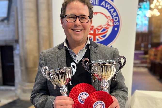 Christian Barrington with his two trophies at the awards ceremony