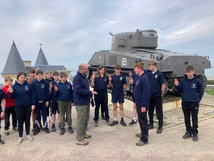 The investiture ceremony for Watchet explorer sea scout Lewis Mossman at Arromanche.