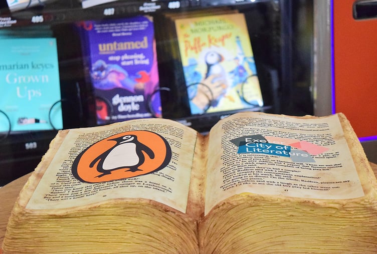 The cake in the shape of a Penguin book.