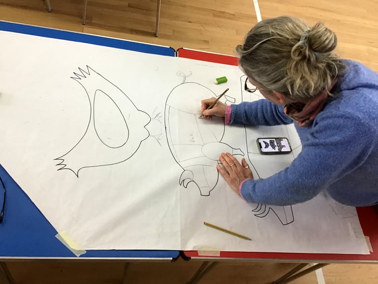 Tracing a design for the Cox's Butchers flag.