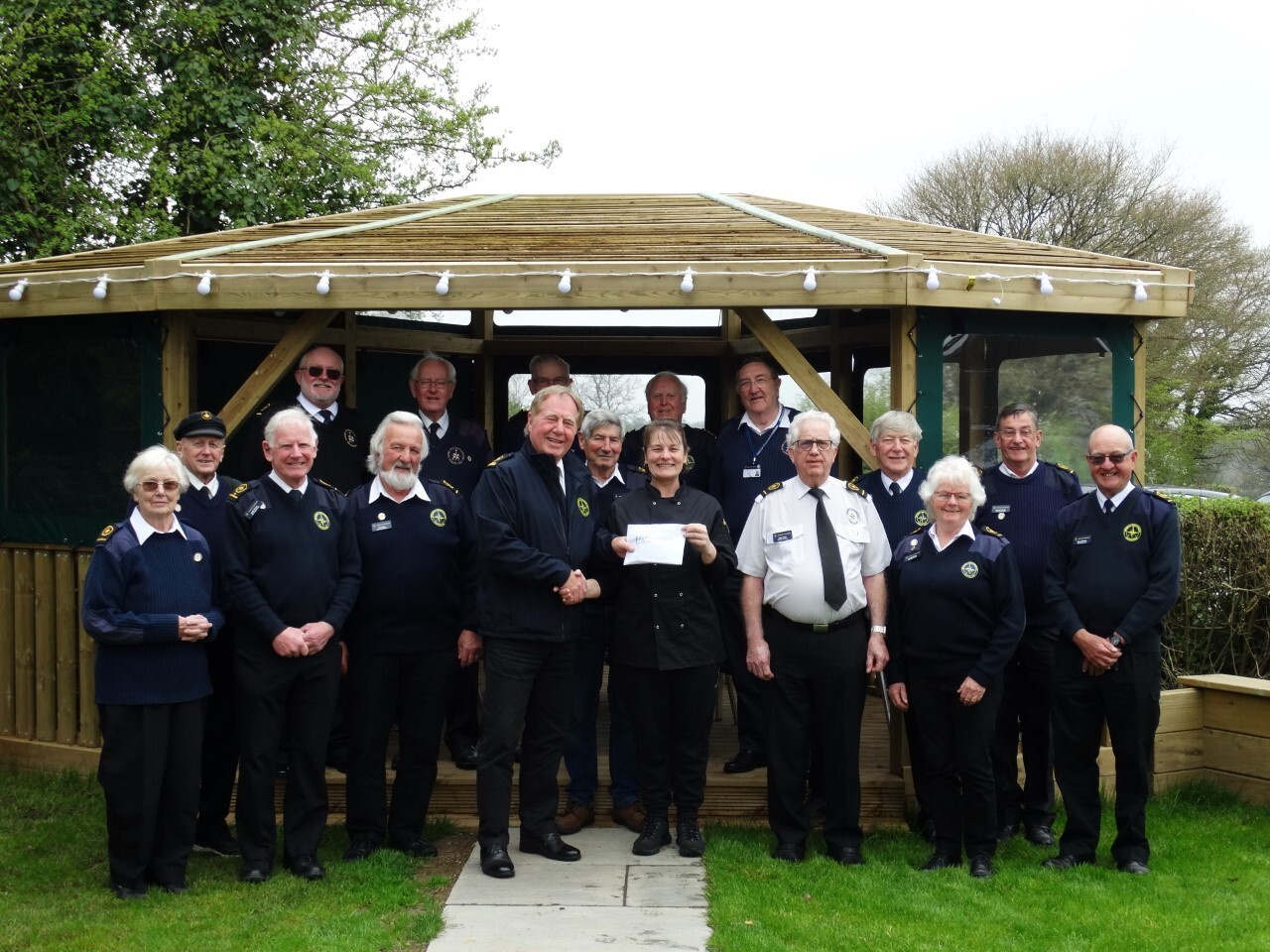 Landlady Debbie Beecher presents £2,420 to National Coastwarch Institution’s Forward Point station manager Andy Westwood