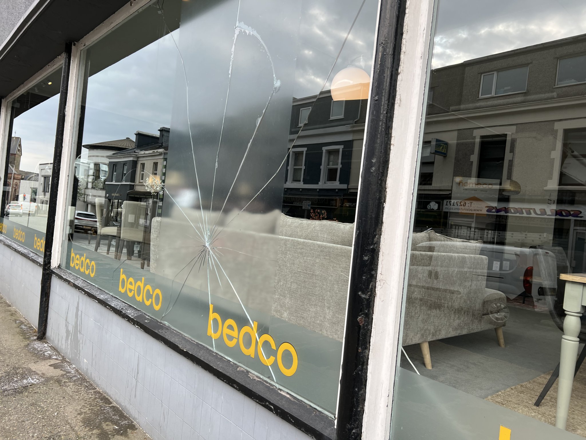 Broken window at Homeco on Buck's Road, Douglas