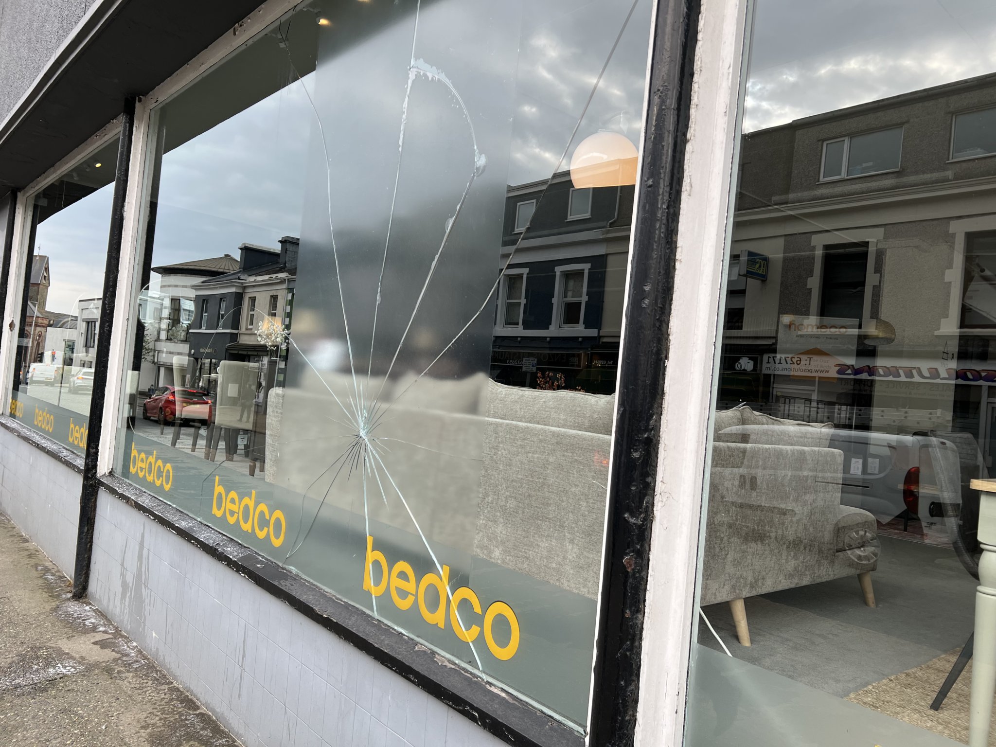 Broken window at Homeco on Buck's Road, Douglas