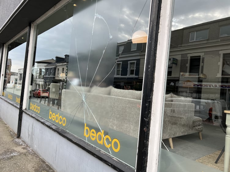 Broken window at Homeco on Buck's Road, Douglas