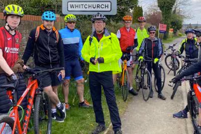 Petersfield Town FC fans cycle to match at Whitchurch United FC, April 2023.