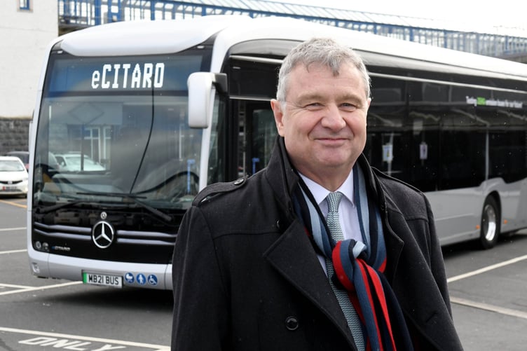 A zero emission Mercedes ‘eCitaro’ electric bus being tested on the island’s roads - pictured is Infrastructure Minister Chris Thomas