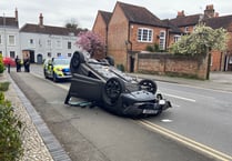 Video: Car overturns after collision with mobility scooter in Farnham