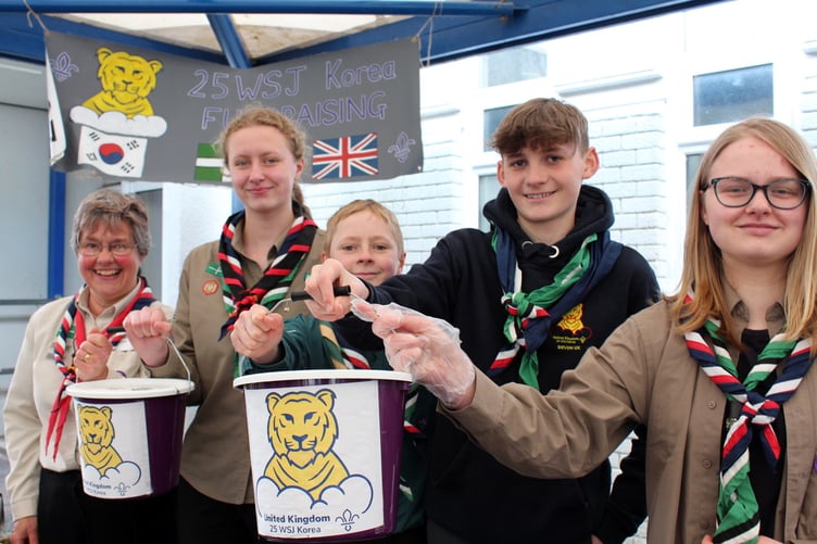 Raising funds for their trip to the World Scout Jamboree in South Korea in August were Linda Atouguia (District Unit Leader) with Ruby Brown and Sam Carling (both Okehampton), Sophie Cooper (Mid Devon Tigers) and James Cooper (Bow). SR 7466