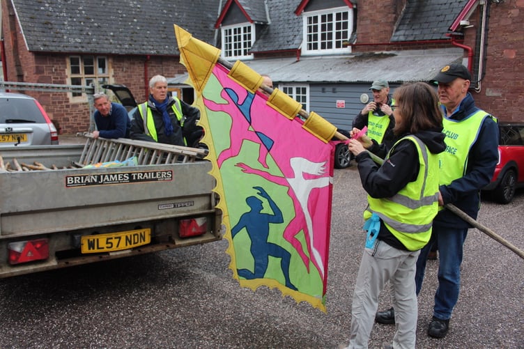 At the Arts Centre Rosemary Stephenson shows how to secure a flag. SR 7525