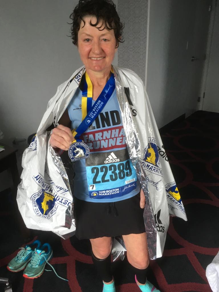 Linda shows off all her medals back in the UK
