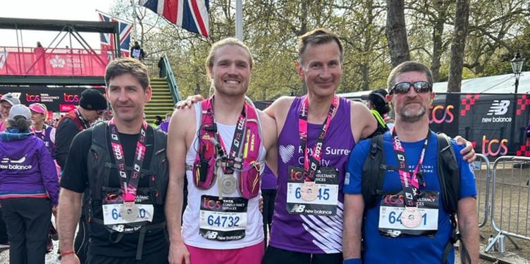 MP Jeremy Hunt is joined at the finish line of his second London Marathon in six months by friends of his brother Charlie's who were all raising money for Sarcoma UK