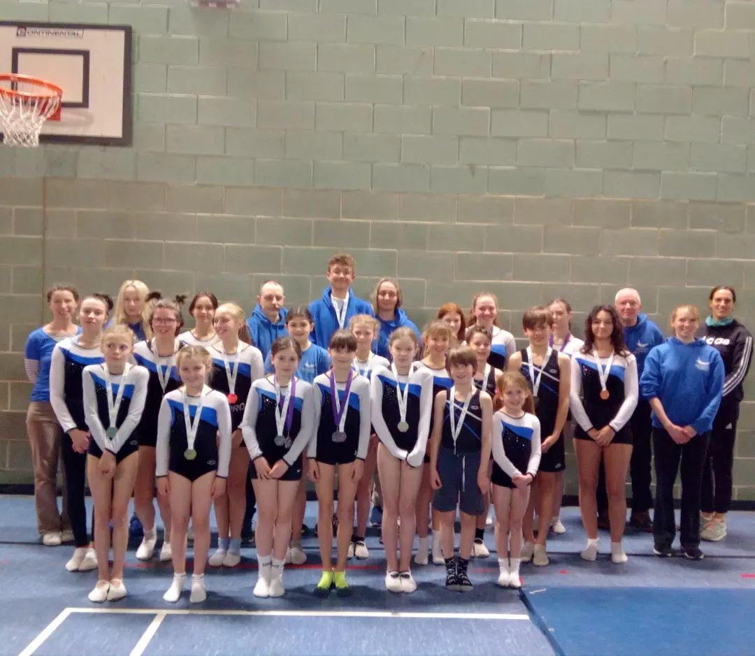 ABOVE: The Okehampton Flyers team and coaches in Bath. RIGHT: Olivia Laverty, Paige Raines, Molly Thorn, Sienna Bryant, Chloe Bifani.