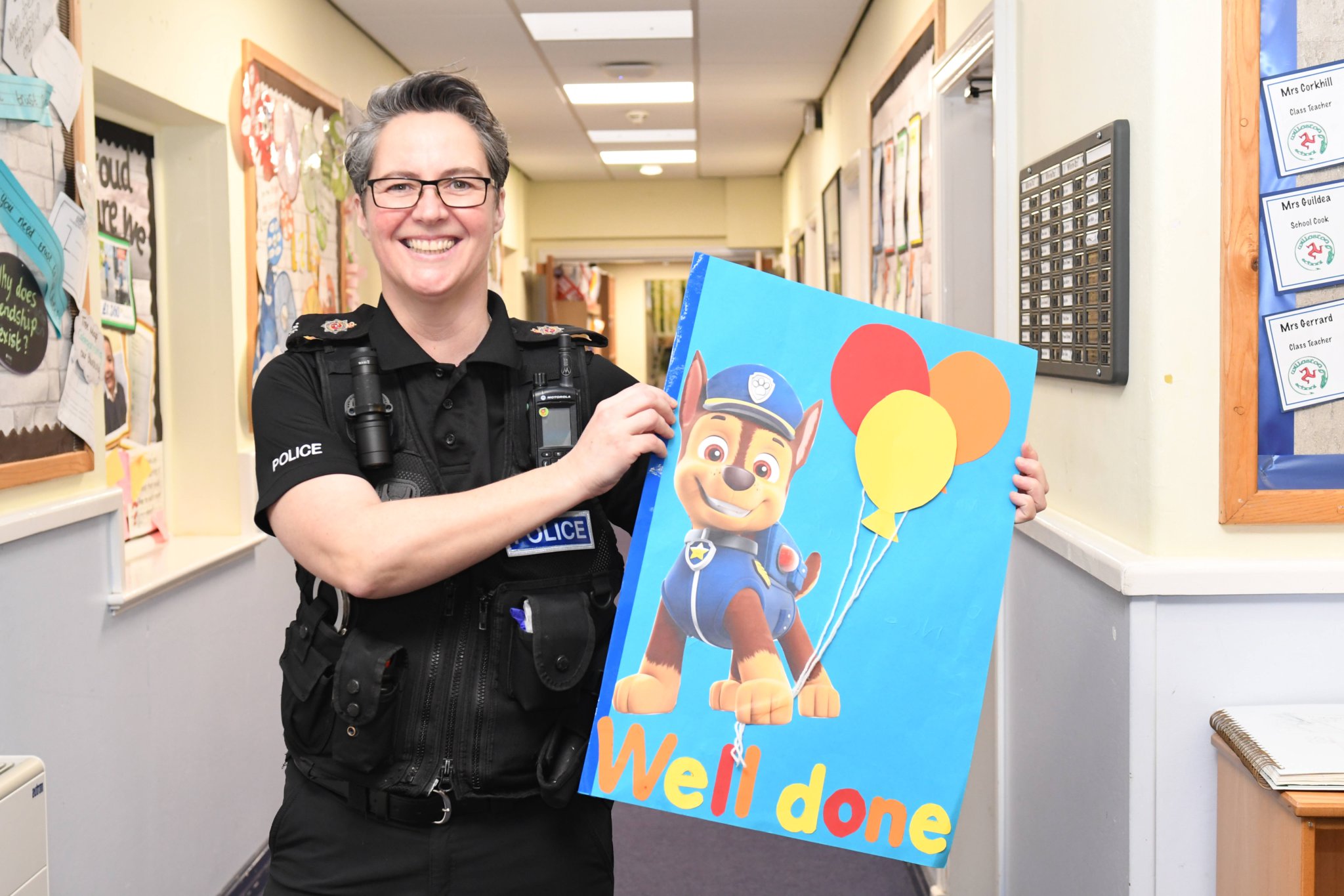 PC Louise Kennaugh, Isle of Man Newspapers' Community Police Officer of the Year, entrusts her trophy to the children of Willaston school in Douglas -