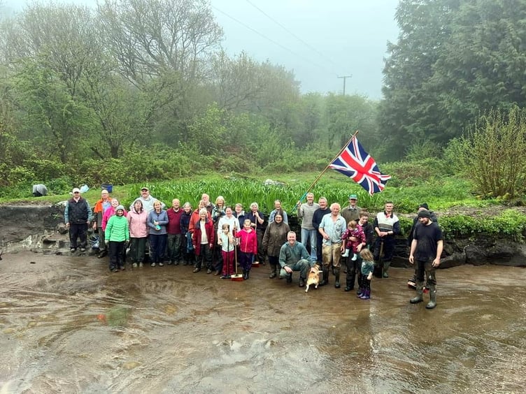 Wet weather did not deter a mini-army of villagers in Peter Tavy walking en-mass to the pond at the Coombe with an array of tools to clear the newly restored pond.