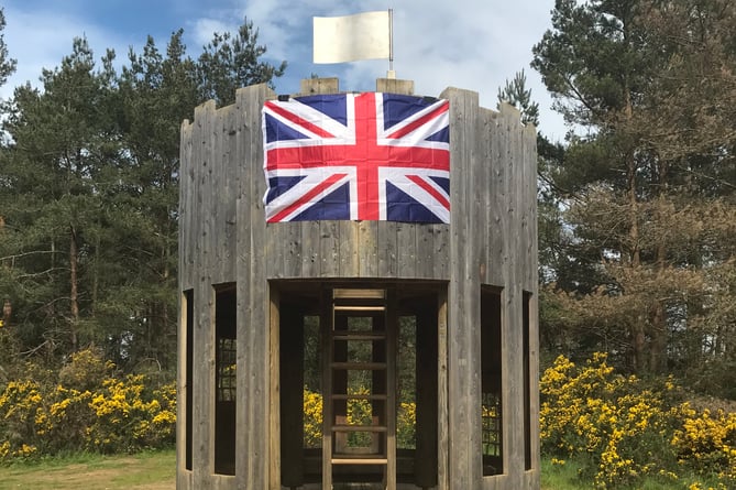 Union Flag on play area fort at Hogmoor Inclosure in Bordon for coronation, May 6th 2023.