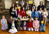 Tavistock Guides and Brownies light candles for Coronation