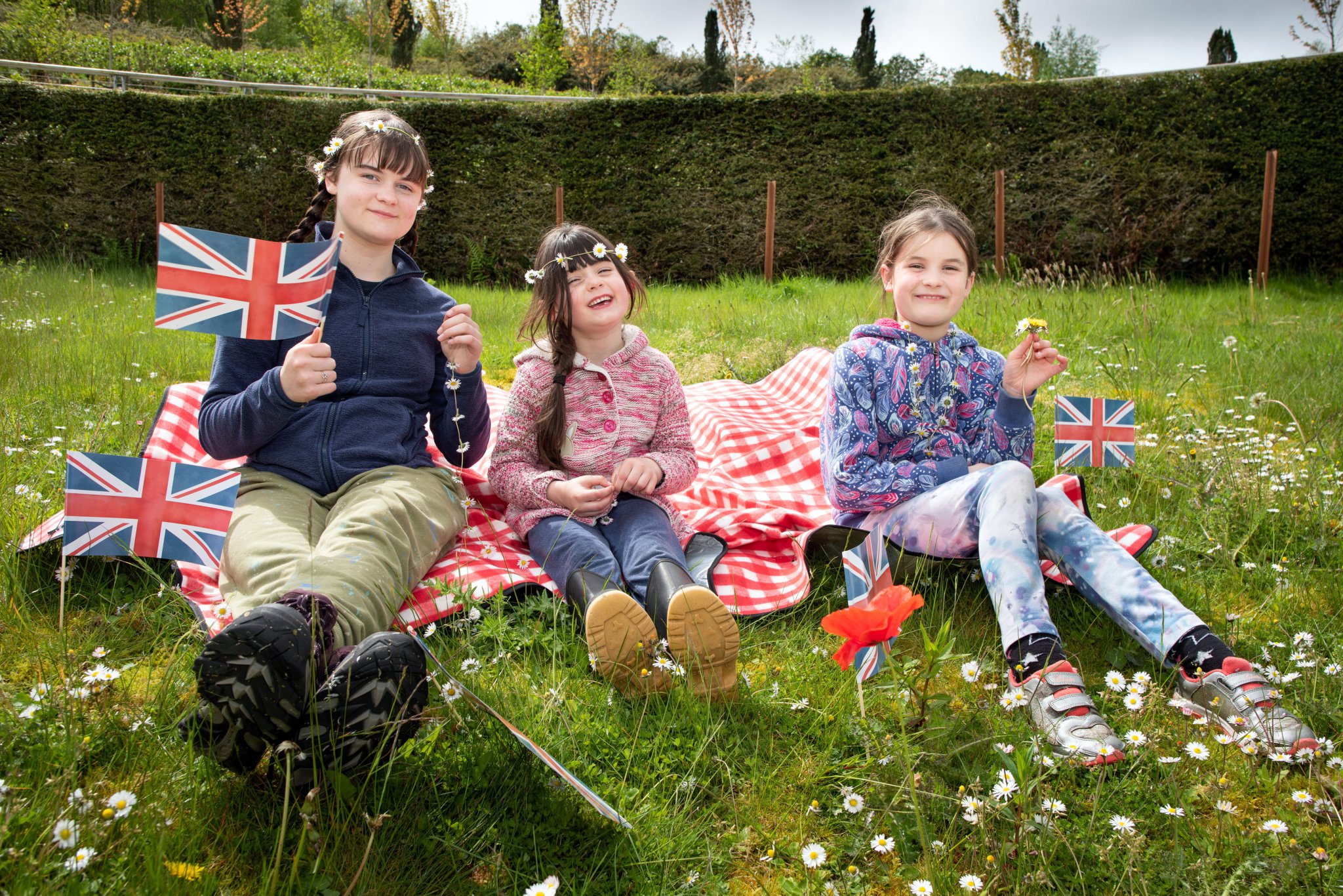 Harmony, Aurora and Carenza Heasman celebrating the Coronation of King Charles III at the Eden Project
