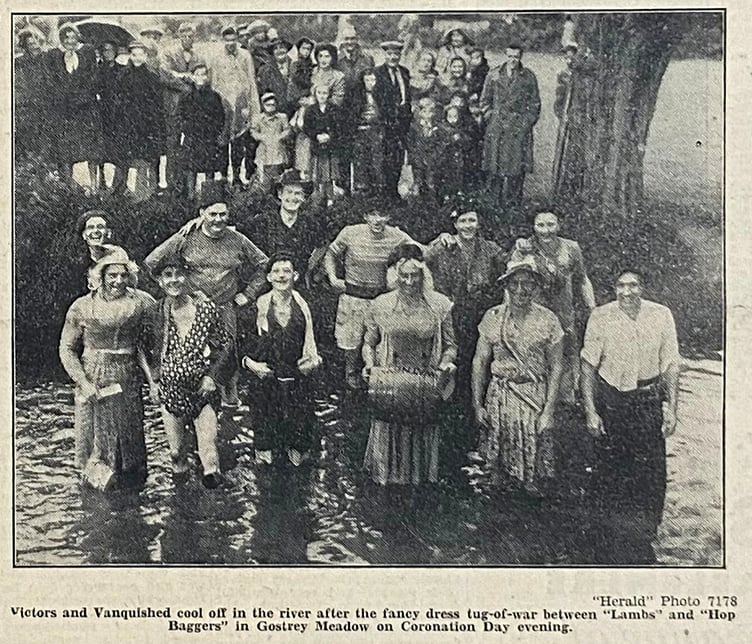 Victors and the vanquished cool off in the River Wey after a fancy dress tug-of-war between ‘Lambs’ and ‘Hop Baggers’ in Gostrey Meadow on Coronation Day evening, 1953
